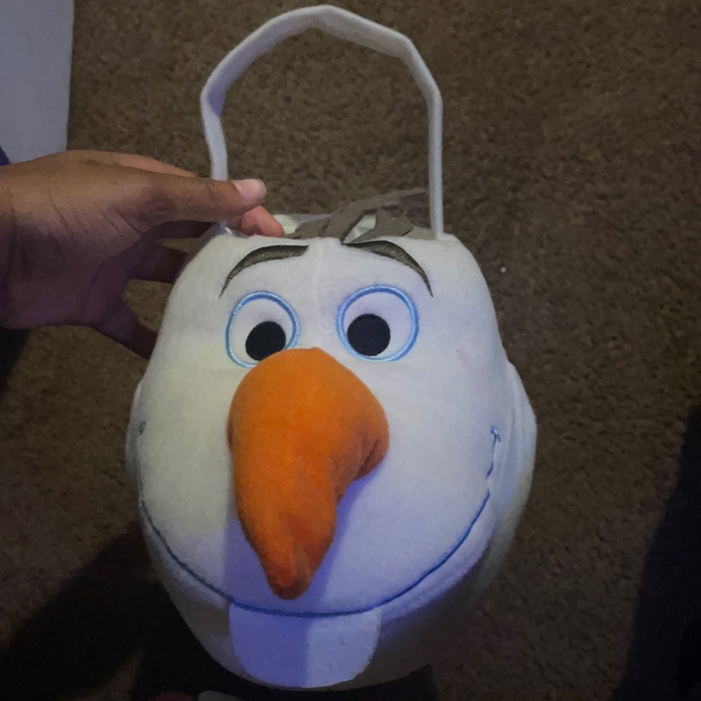 I am selling a white Disney Olaf trick-or-treat basket that used to cost $70